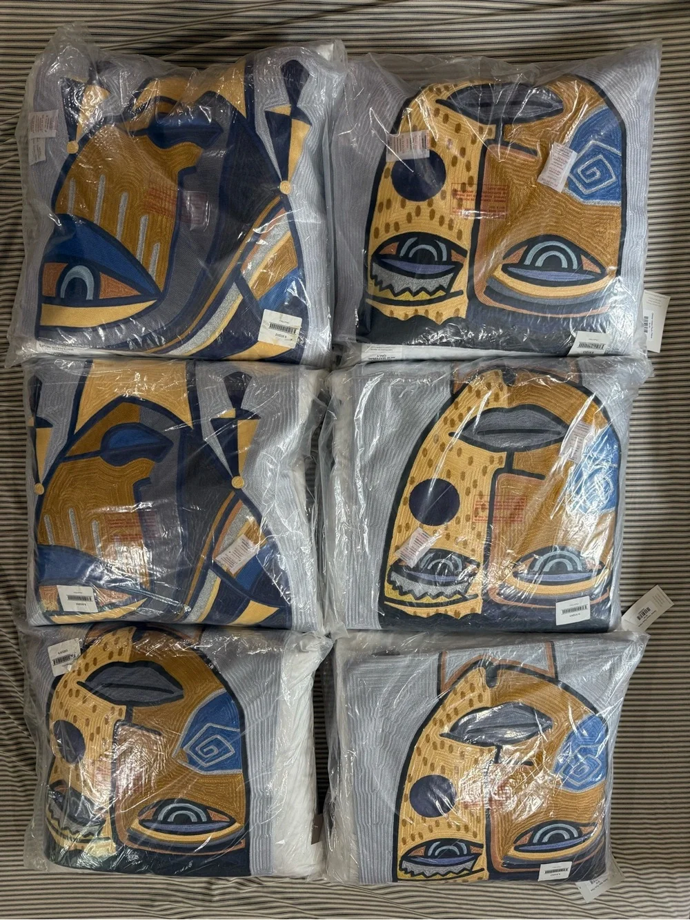 Global Views Abstract Face Accent Pillow in Yellow, Blue, Black, Gray